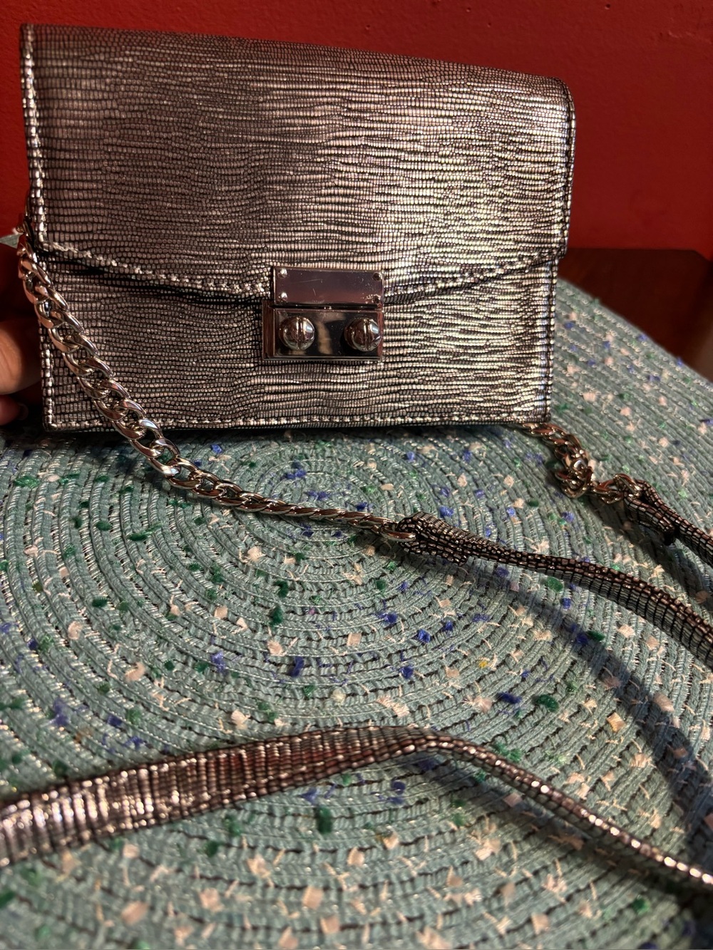 Express Metallic Silver Crossbody Bag with partial Chain Strap.